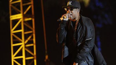 Jay Z makes a surprise guest appearance during the set of rapper Nas at the 2014 Coachella Music and Arts Festival in California. (Photo by Chris Pizzello/Invision/AP)