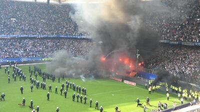 HSV supporters light flares during the German Bundesliga soccer match between Hamburger SV and Borussia Moenchengladbach in Hamburg, Germany, on May 12, 2018. David Hecker / EPA