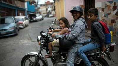 Venezuelans pose in Caracas. AP