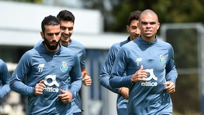FC Porto's FC Porto's Portuguese defender Pepe (R) and FC Porto's Portuguese midfielder Sergio Oliveira (L) attend a training session at the club's training ground of Olival, in Vila Nova de Gaia, on April 12, 2021, on the eve of the UEFA Champions League quarter final second leg football match between FC Porto and Chelsea. / AFP / MIGUEL RIOPA