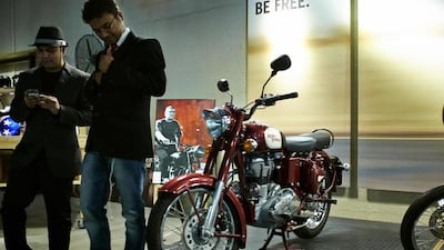 A Steve Mcqueen, ‘The King of Kool’ poster adorns the wall inside the Cafe Rider venue in Al Quoz where sixty plus Gentleman met for the start of the Distinguished Gentleman’s Ride 2014 in Dubai. All photos by Antonie Robertson / The National