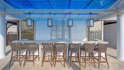 A taverna-style outdoor dining area. Courtesy The Urban Nest