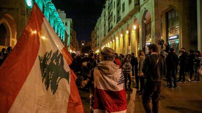 Lebanese anti-government protesters carry candles and national flags as they march against the incitement of sectarian strife, and for the freedom of religious expression on the 63rd day of Lebanon's nationwide anti-government. EPA