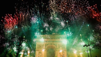 Fireworks illuminate the sky over the Arc de Triomphe during the New Year's celebrations on the Champs Elysees avenue in Paris, on January 1, 2023. Reuters