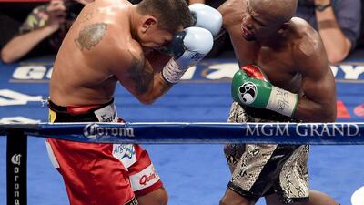 Floyd Mayweather, right, scored a comfortable victory over Marcos Maidana, left, in their rematch in Las Vegas on Saturday night. Ethan Miller / Getty Images / AFP / September 13, 2014