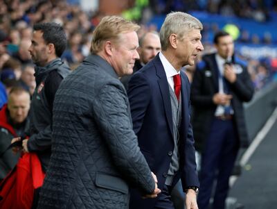 Ronald Koeman, left, is under pressure to keep his job, while Arsene Wenger had a happy birthday. Phil Noble / Reuters