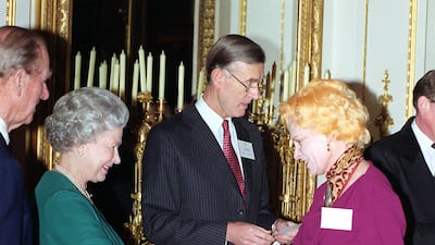 Queen Elizabeth II and Westwood at Buckingham Palace in March 1999. PA