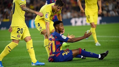 Barcelona´s Guinea-Bissau forward Ansu Fati reacts after falling on the ground. AFP