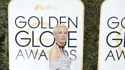 Michelle Williams, in white lace Louis Vuitton at the 2017 Golden Globes in Los Angeles on January 8, 2017. Getty Images