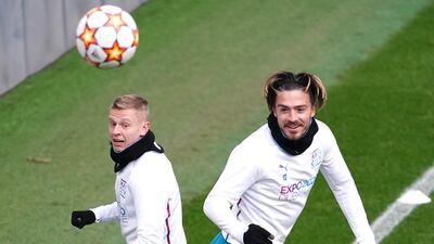 Oleksandr Zinchenko, left, and Jack Grealish work with the ball. PA