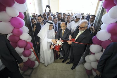 Mohamed Al Emadi, left, chairman of Qatar's Committee for the Reconstruction of Gaza, at the opening of the Palace of Justice. Getty Images