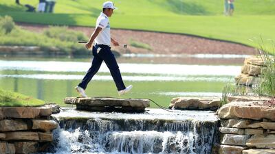 Hideto Tanihara crosses between the 6th and 7th holes during the second round of the DP World Tour Championship. Andrew Redington / Getty Images