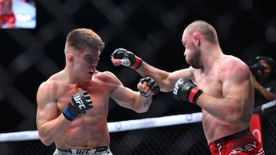 Caolan Loughran of Northern Ireland punches Jake Hadley of England during their bantamweight fight, which Hadley won by decision. Getty Images