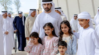 Sheikh Hamdan bin Mohammed meets young community members in Nad Al Sheba 4, which is home to the first Hewi scheme. Photo: Dubai Media office / X