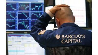 A traders watches his screen on the floor of the New York Stock Exchange.