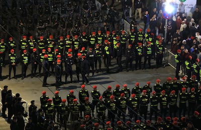 Rows of security forces keep watch during a rally near the Israeli embassy in Amman on March 27. EPA