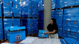An Israeli worker prepares packing of ballots and polling station equipment at the Central Elections Committee's Logistics Center in Shoham. Getty Images
