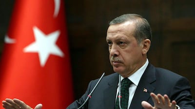 Turkey's Prime Minister Recep Tayyip Erdogan addresses members of parliament from his ruling AK Party (AKP) during a meeting at the Turkish parliament in Ankara. AFP
