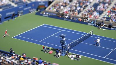 An image made with a tilt-shift lens showing Novak Djokovic hitting a return to Kei Nishikori. CJ Gunther / EPA
