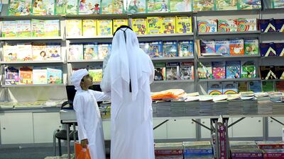 Visitors take a look at the books during the Sharjah International Book Fair at the Sharjah Expo Centre in Sharjah. Satish Kumar for the National