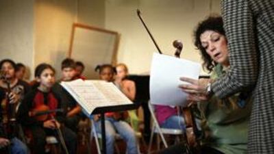 Roberta Guaspari, the director and founder of the Harlem School of Music, conducts a violin class.