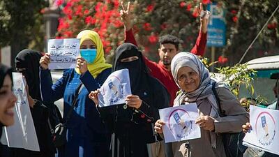 Activists demanding the abolition of guardianship on women's passports during a protest in front of the Passports and Immigration Building in early February 2022, in the city of Taiz, Southern Yemen.