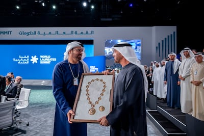 President Sheikh Mohamed presents the Order of the Union medal to Mohammed Al Gergawi during the opening ceremony of the World Laureates Summit. Photo: UAE Presidential Court