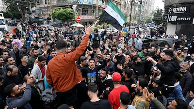 Lebanese and Syrians celebrate in Beirut after the rebel takeover of Damascus on Sunday. EPA
