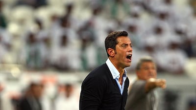Coaches of both sides were visibly animated throughout the game with the game suddenly even. Enrique Sanchez Flores, left, the Spaniard with a great cup record, barks out his orders as does Shabab's Marcos Pacqueta. Satish Kumar / The National