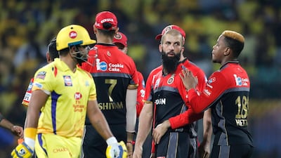 Royal Challengers Bangalore's Moeen Ali, second right, celebrates with teammates the dismissal of Chennai Super Kings' Suresh Raina, left, during the VIVO IPL T20 cricket match between Chennai Super Kings and Royal Challengers Bangalore in Chennai, India. AP Photo