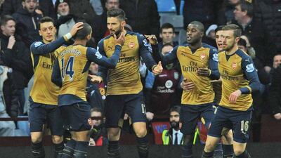 Arsenal’s Olivier Giroud, third from left, is congratulated by teammates after scoring from the penalty spot during the English Premier League match against Aston Villa at Villa Park in Birmingham on Sunday. Rui Vieira / AP Photo