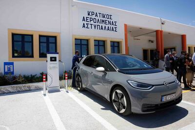 A Volkswagen ID. 4 electric car is charged at the airport of the Aegean Sea island of Astypalea, Greece. AP