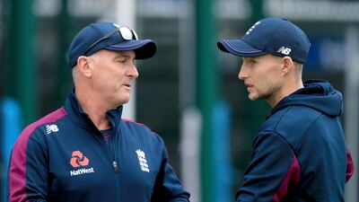 Joe Root, right, with coach Graham Thorpe during a nets session. PA