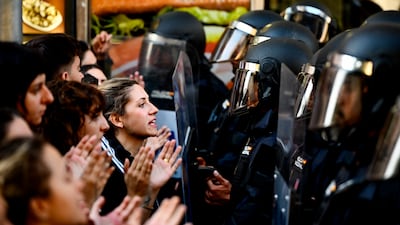 Protestors form a barricade in front the building where Mari Carmen, 87, was evicted from her home after a vulture fund bought her flat and multiplied the rent by five, Madrid. EPA