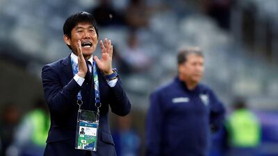 Japan manager Hijame Moriyasu shouts instructions to his team. EPA