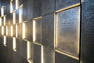 The names of service personnel who lost their lives while on duty are inscribed on the wall at Wahat Al Karama. Christopher Pike / The National