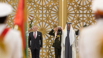 Sheikh Mohamed bin Zayed, Crown Prince of Abu Dhabi and Deputy Supreme Commander of the Armed Forces, and King Abdullah II stand for the national anthem.