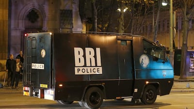A police elite squad van arrives in Saint-Denis, a northern suburb of Paris. Explosions and gunfire rang out early Wednesday as heavily armed police surrounded a suburban Paris apartment in a raid targeting the suspected mastermind of last week’s Paris attacks. Francois Mori / AP