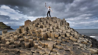 Lucy Walton holds the baton at the top of the Giants Causeway in Portrush, Northern Ireland. Getty Images