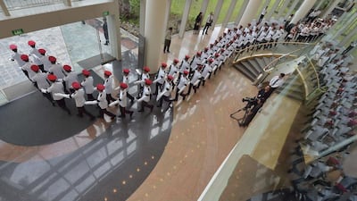 Honour guards march following the funeral service for Singapore’s former prime minister during his funeral. Tens of thousands of mourners braved torrential rain, howitzers fired a 21-gun salute and jet fighters screamed across the skyas Singapore staged a grand funeral for its founding leader, Lee Kuan Yew. Adek Berry/AFP