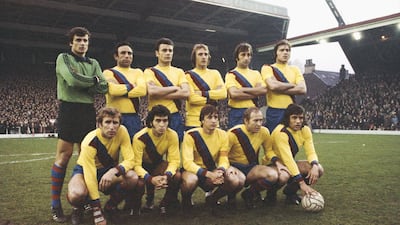 Johan Cruyff, front centre, with the Barcelona team before their Uefa Cup semi-final, second leg against Liverpool at Anfield in 1976. Getty