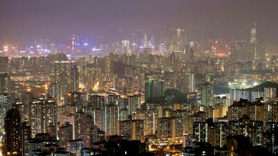 Prime residential prices in Hong Kong will fall owing to increased supply and stringent cooling measures. Alex Ogle / AFP