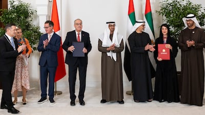 Sheikh Mohamed, Mr Parmelin, Sheikh Khaled, Reem Al Hashimy, UAE Minister of State for International Co-operation, and Dr Sultan Al Jaber, UAE Minister of Industry and Advanced Technology and managing director and group chief executive of Adnoc, attend a ceremony for the signing of agreements between the UAE and Switzerland