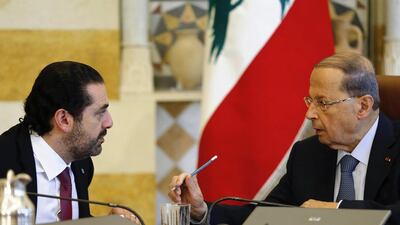 Lebanon's President Michel Aoun talks to Prime Minister Saad Al Hariri during a cabinet meeting. The country went to the polls two months ago. REUTERS