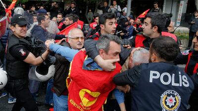 Police scuffle with demonstrators during May Day protests in Istanbul. Lefteris Pitarakis / AP Photo