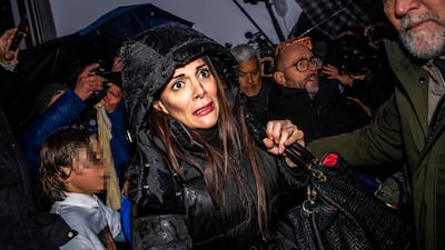 Le Constellation bar owner Jessica, centre, arrives at a hearing in Sion focused on the deadly fire at the Swiss ski resort on New Year's Eve. AFP