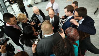 The remarks by Akbar Al Baker, chief executive officer of Qatar Airways, centre, remarks were met with boos and gasps at the press conference, and he subsequently apologised for them. Brendon Thorne/Bloomberg