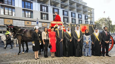 His Excellency Mansoor Abulhoul following his visit with Her Majesty The Queen at Buckingham Palace for the presentation of diplomatic credentials. Seen here with his wife in red with black hat, Victoria Devin and the Assistant Marshal of the Diplomatic corps with feathers in hat. Outside the Lanesborough Hotel in central London where the reception HE Mansoor Abdulhoul's Vin d'honneur took place.