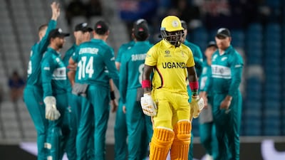 Uganda's Simon Ssesazi walks off the field after being trapped LBW for a duck by New Zealand's Trent Boult. AP