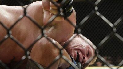 Brock Lesnar, top, fights Mark Hunt during their heavyweight bout at UFC 200, Saturday, July 9, 2016, in Las Vegas. John Locher / AP Photo